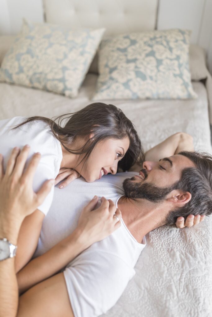 young couple hugging bed (1) (1)